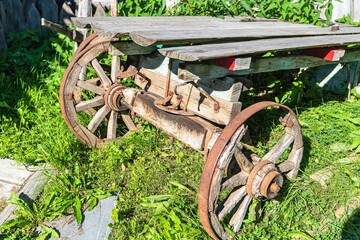 An old dilapidated cart in a rural courtyard.