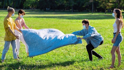 Fototapeta na wymiar Picnic blanket in a park in Chisinau, Moldova