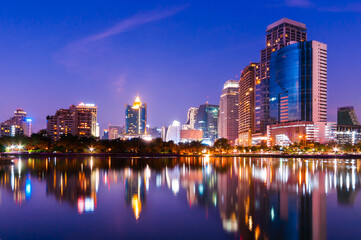 City downtown skyline at night with water reflection, Bangkok,Thailand