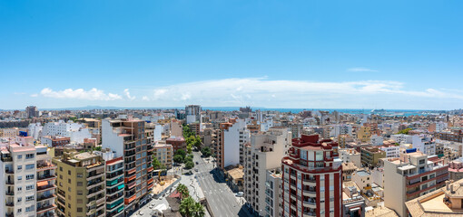 Panoramic from high altitude of the views of Palma de Mallorca, skyline, blue sky and views of the sea and the port.
