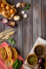 Dinner table with fresh homemade food - eggs, bread, potatoes. Overhead view