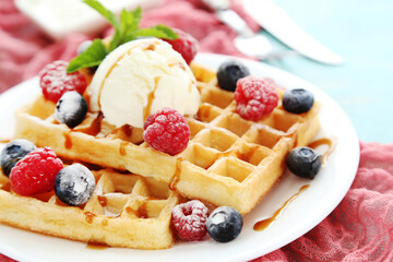 Tasty waffles with fresh berries and ice cream