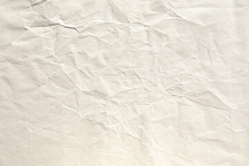 Obraz premium Crumpled pale brown background paper texture