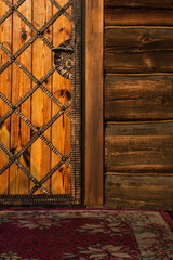 entrance to the old wooden church, door with carpet