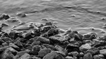 Coastal stones in contact with water