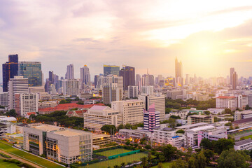 Obraz na płótnie Canvas Aerial view of Bangkok modern office buildings, condominium in Bangkok city downtown with sunset sky in Bangkok , Thailand