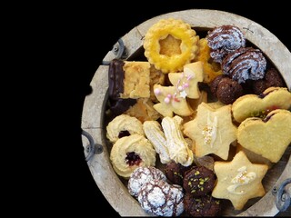 Christmas sweet biscuits in a variety of flavours with black background
