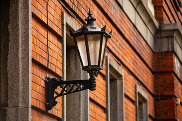 Fototapeta na wymiar Vintage black gothic street wall lantern in old town of Riga (Vecriga), Latvia.