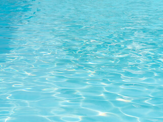 Background of rippled water in swimming pool.