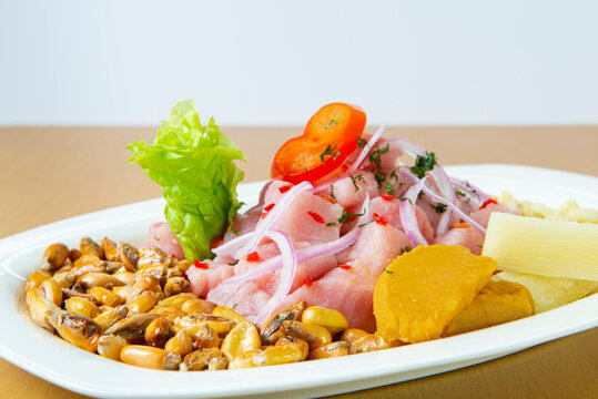 Delicious seafood ceviche from Peru with chili peppers, chickpeas. Close up.
