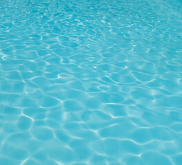 Fototapeta na wymiar Blue rippled water in swimming pool.