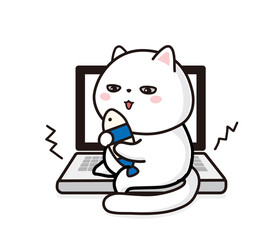 パソコンの上で玩具で遊ぶ白猫