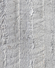 Fototapeta premium grey concrete wall closeup with wooden planks pattern imprint, seamless background