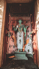 A colorful statue of a Hindu god, relief in a Hindu temple.