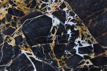 Gold yellow and white patterned natural of dark marble pattern background texture.
