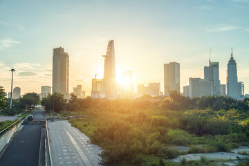 Fototapeta na wymiar Beautiful landscape sunset of Ho Chi Minh city or Sai Gon, Vietnam. Bitexco Financial Tower and skyscraper buildings. Business and landscape concept.
