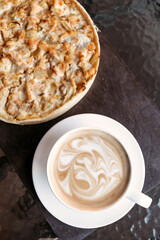 Quiche pie, cup of large cappuccino. Menu for cafe.