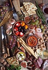 The Ultimate Appetizer Platter. Charcuterie Board with various of cured meat, chees, nuts and fruits. 