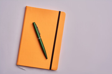 Notebook and pen isolated on white background.