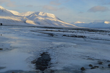 Kite surfing in the ice fjord outside of Longyearbyen in Svalbard (Spitsbergen), Norway