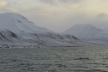 Winter sunset over the ice fjords of the Archipelago of Svalbard (Spitsbergen) in Norway