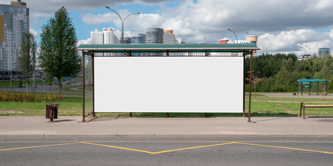 large blank white poster for mockup place in iron frame of bus stop