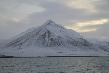 Winter sunset over the ice fjords of the Archipelago of Svalbard (Spitsbergen) in Norway