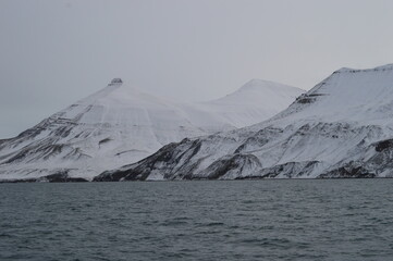 Winter sunset over the ice fjords of the Archipelago of Svalbard (Spitsbergen) in Norway