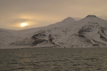 Winter sunset over the ice fjords of the Archipelago of Svalbard (Spitsbergen) in Norway