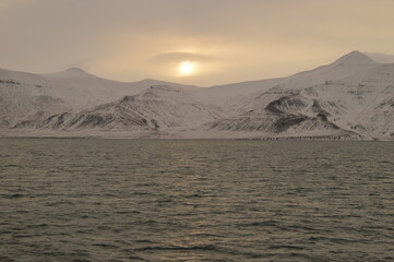 Winter sunset over the ice fjords of the Archipelago of Svalbard (Spitsbergen) in Norway