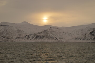 Winter sunset over the ice fjords of the Archipelago of Svalbard (Spitsbergen) in Norway