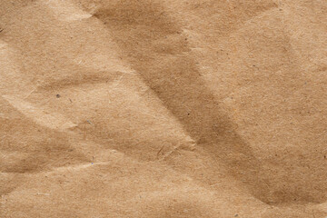 Brown crumpled paper recycled kraft sheet texture background