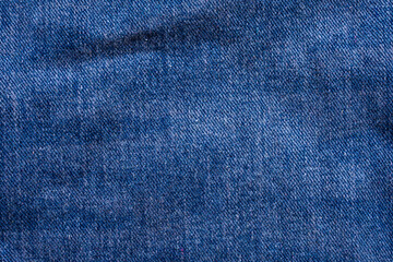 Naklejka premium Denim blue jeans texture close up background top view
