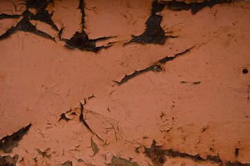 Rust and oxidized background. Old iron panel. Red, brown and black rust on the metal plate. Grunge rusted metal abstract texture. Rusted metal wall. Rusty metal surface with streaks of rust.