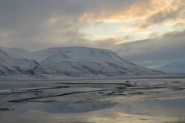 Sunset in the ice fjords of the Norwegian Archipelago of Svalbard, Norway