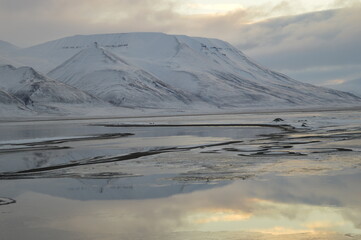 Sunset in the ice fjords of the Norwegian Archipelago of Svalbard, Norway