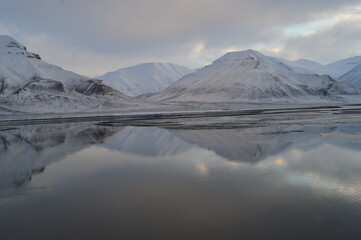 Sunset in the ice fjords of the Norwegian Archipelago of Svalbard, Norway