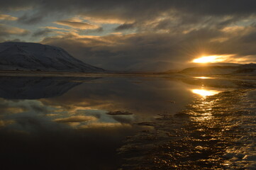 Sunset reflections over the frozen Arctic Norwegian Archepelago of Svalbard, Norway