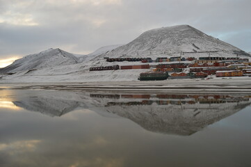 Sunset reflections over the frozen Arctic Norwegian Archepelago of Svalbard, Norway