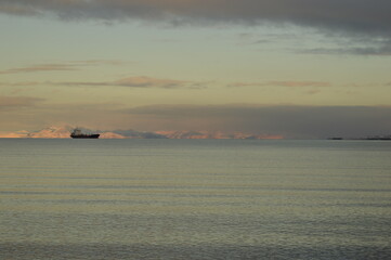 Sunset reflections over the frozen Arctic Norwegian Archepelago of Svalbard, Norway