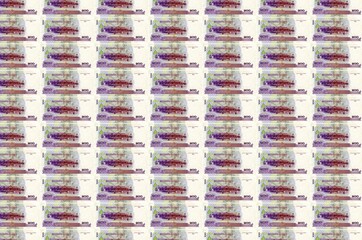 100 Cambodian riels bills printed in money production conveyor. Collage of many bills. Concept of...