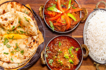 assorted indian curry and rice dishes .Indian food shot from top view.