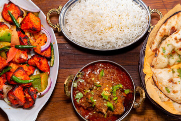 assorted indian curry and rice dishes .Indian food shot from top view.