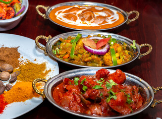 assorted indian curry and rice dishes .Indian food shot from top view.