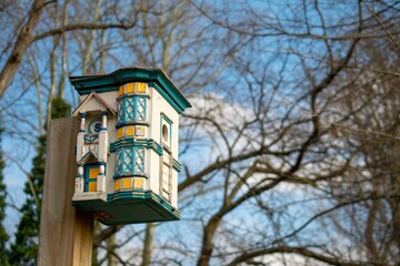 A Detailed Birdhouse Fashioned to Look Like a Real House
