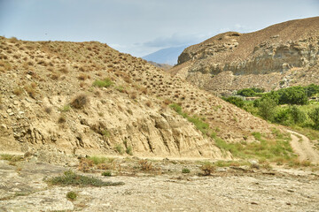 a sandy road in the mountains of Asia. sand surface dried without rain