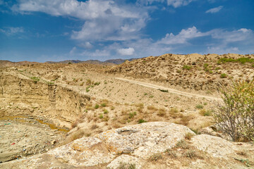 view of the mountains and the dry polluted riverbed in the highlands of Asia