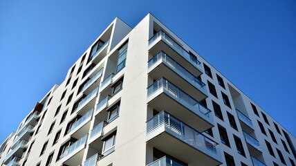 Obraz premium Architectural details of modern apartment building. Modern european residential apartment building complex.