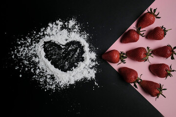 Kitchen table with products, top view. Strawberry and flour. Top view in frame only ingredients.