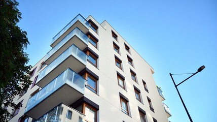 Obraz na płótnie Canvas Architectural details of modern apartment building. Modern european residential apartment building complex.